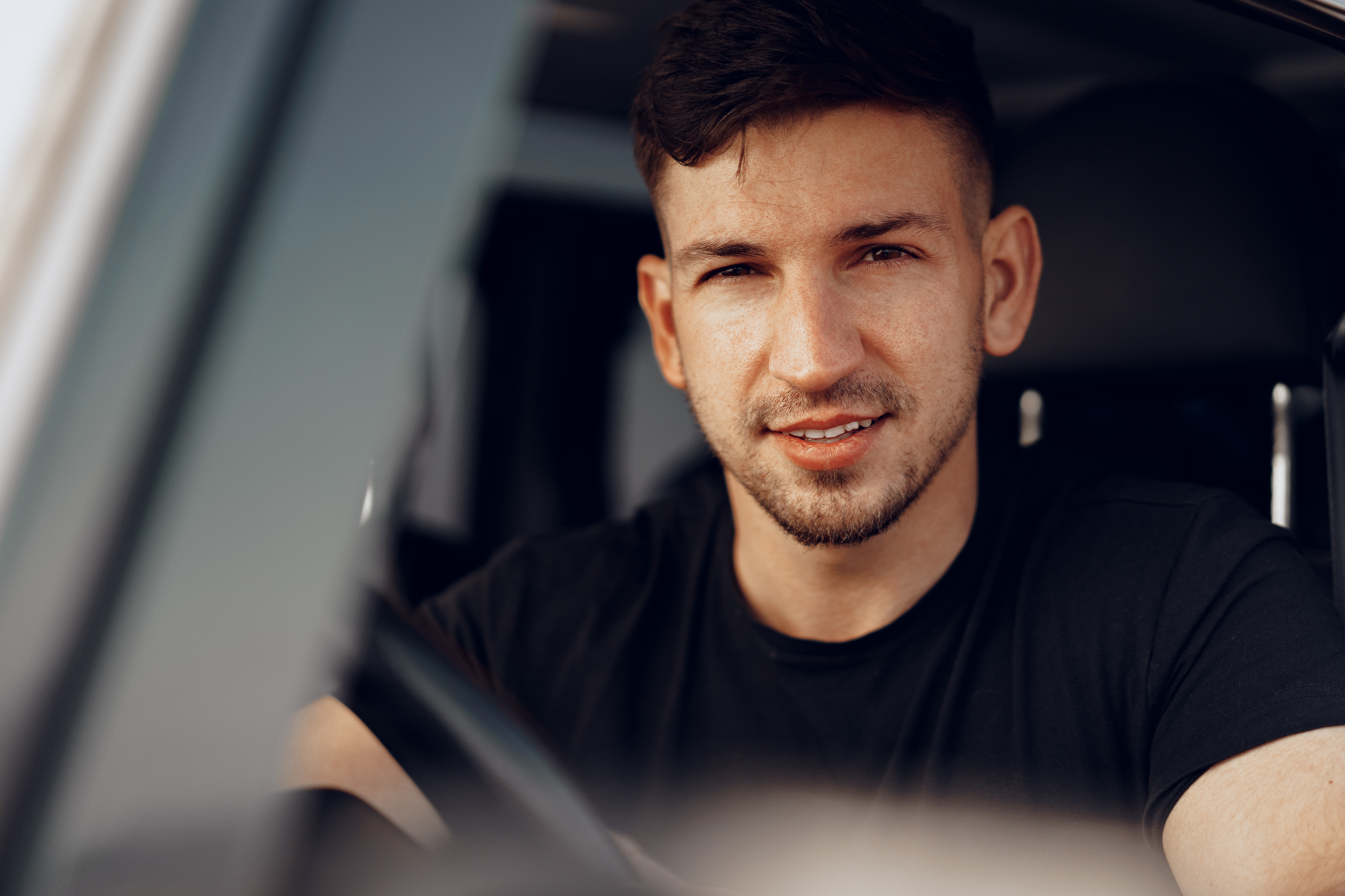 handsome-young-man-driver-looking-through-window-his-off-road-car.jpg